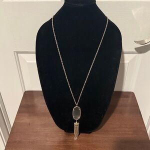 Kendra Scott Rayne gold tassel necklace with a slate cat's eye stone